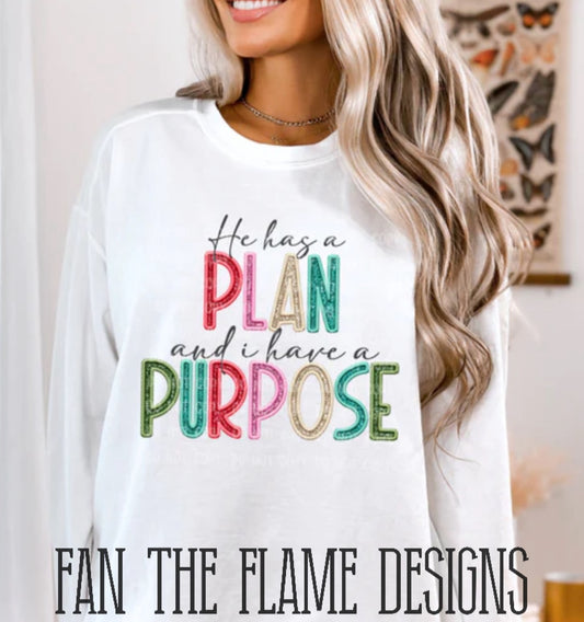 He has a PLAN tee/sweatshirt